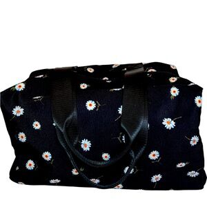 Stylish White Daisy Pattern on Black Travel Tote by Alice & Olivia—Stacey Bendet
